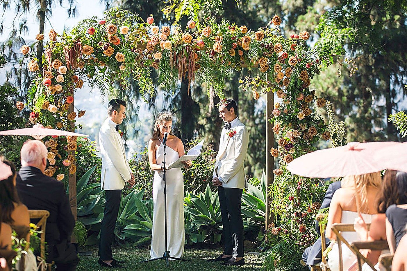 Maximal floral style — a lush, abundant ceremony arch